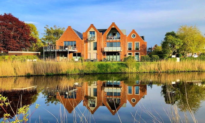 Carolinensiel Apartment | ☼ Penthouse on the Harle ☼ Uniquely beautiful living right on the water + sauna, fireplace
