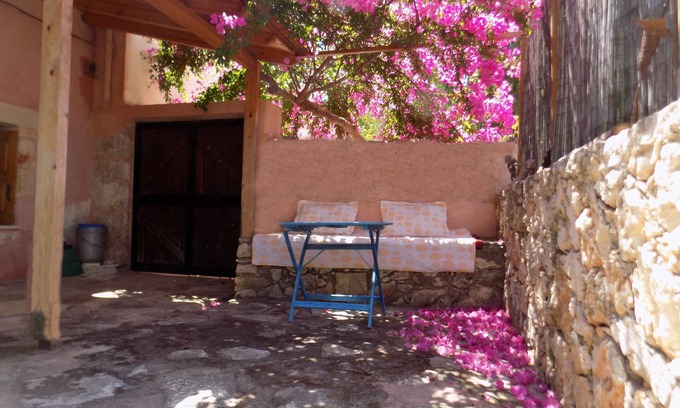 Plaka Cottage | Plakoura, a quiet cottage in village square of Plaka with a view to the sea.