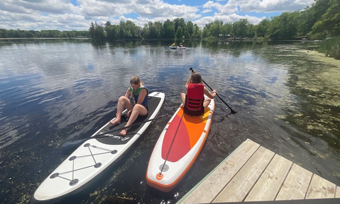 Amery Cabin | Private 3bdr cabin on Apple River kayaks, SUPS, and paddle boat. Pet friendly!