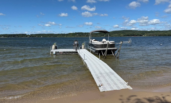 East Jordan House | Private DOCK & Beach on Lake Charlevoix/Pontoon Rental/GolfCart/RV Parking