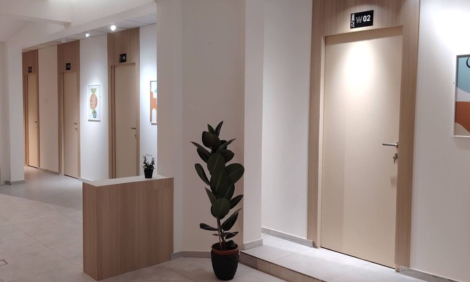 Buraydah Cabin | Private room 8m for men. Bed, AC, side table, Wi-Fi. Shared baths, lounges.