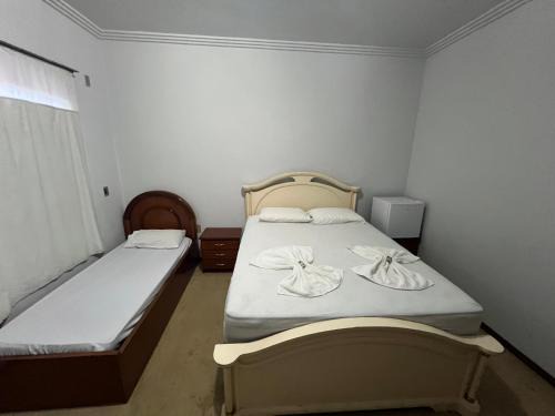 Sinop House | Quarto no centro com 2 camas e hidromassagem