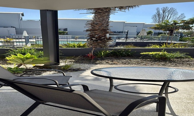Batehaven Apartment | Relax by the Pool in This Stylish Batehaven Stay