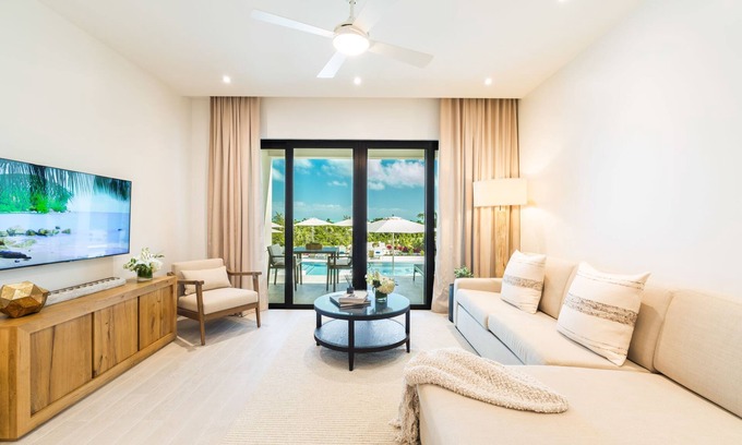Long Bay Hills Resort | Relax on a Juliette balcony with an ocean & pool view!