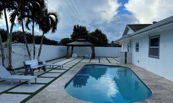 Royal Palm Beach House | Remodeled cozy family house with heated pool, 10 min from the airport!