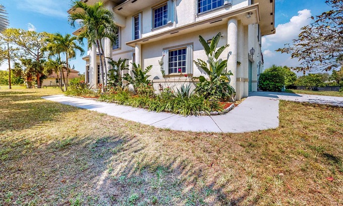Loxahatchee House | Renovated, elegant retreat with a fitness room, work desks, large deck, & W/D