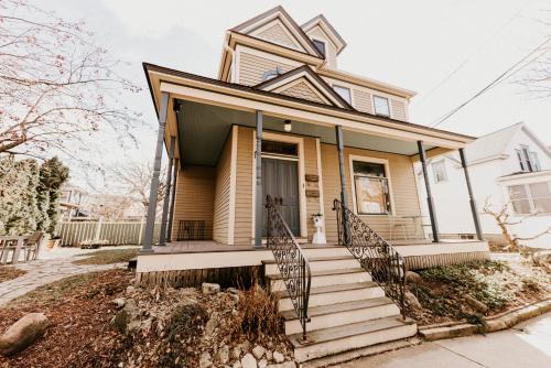 West Seventh Apartment | Retro Gem Box Victorian Steps from Irvine Park