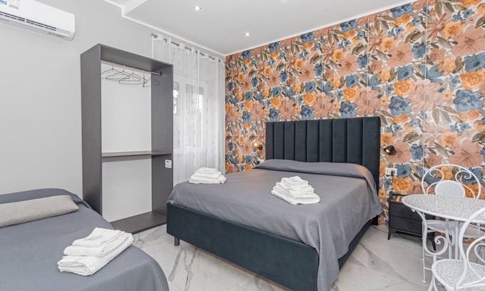 Monte Po-Nesima-San Leone-Rapisardi Apartment | Room 'Dolce Relax - Tripla Luxury' with Wi-Fi and Air Conditioning