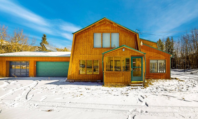 Cripple Creek House | Rustic home with mountain views, wood-burning stove, basketball court, & patio