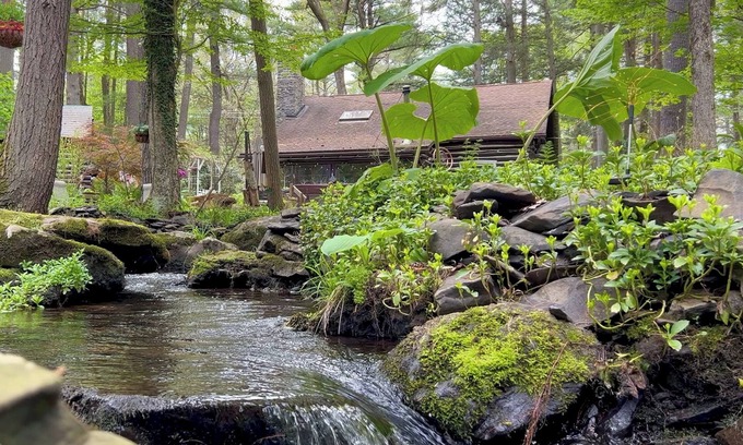 East Stroudsburg Cabin | Rustic Rest Log Cabin, with hot tub and trout stream, near Poconos attractions.