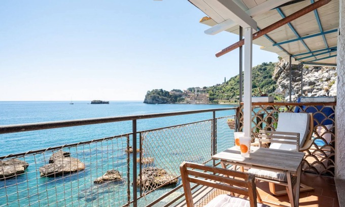 Spisone Apartment | Sea view apartment of about 90 sqm, able to accommodate up to 4 people, located on the ground floor of a building.The property is located in Taormina, in a unique panoramic position, suspended above a rock and with the beach right in front of the apartme