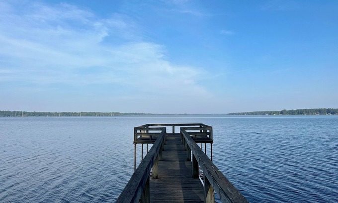 Lafayette County House | Secluded getaway with lakefront views. Spacious covered deck and dock access.