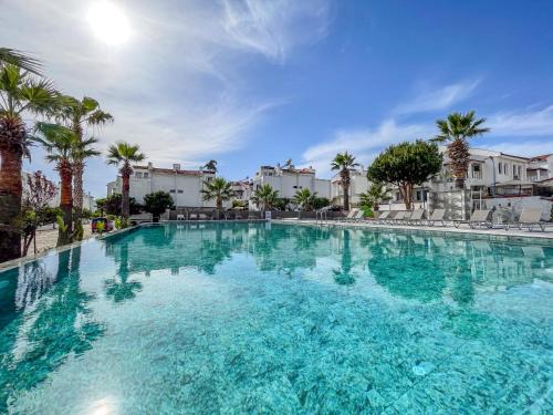 Kadnlar Denizi Mahallesi House | Semi Detached Villa in Complex with Shared Semi Olympic Swimming Pool in Kusadasi