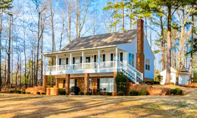 Henrico House | Serene Lakefront Escape with Sunset Views, Private Boathouse, and Endless Fun!