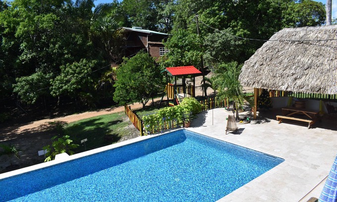 Unitedville Cabin | Set in jungle, Wild Orchid is a self catering 2 bedroom cabin with private porch