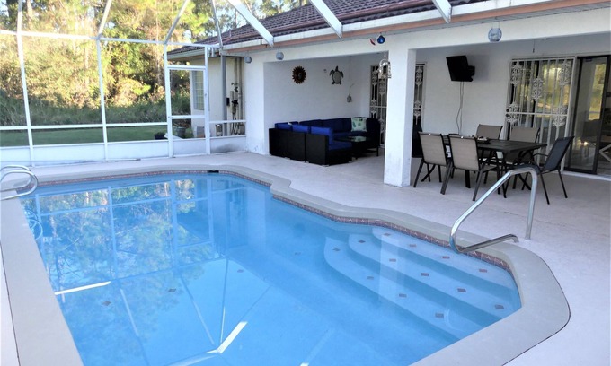 Palm Coast House | Spacious Heated Pool Home with Pool & Ping Pong Table