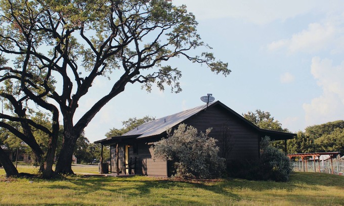 Leakey Cabin | Springs Cabin located near the pool area.