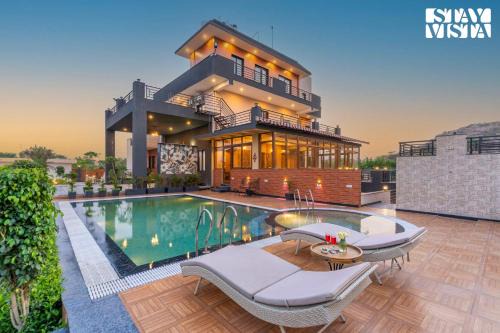 Gurugram Villa | StayVista's Shivoham Farms - Mountain-View Villa with Outdoor Pool, Lawn, and Terrace