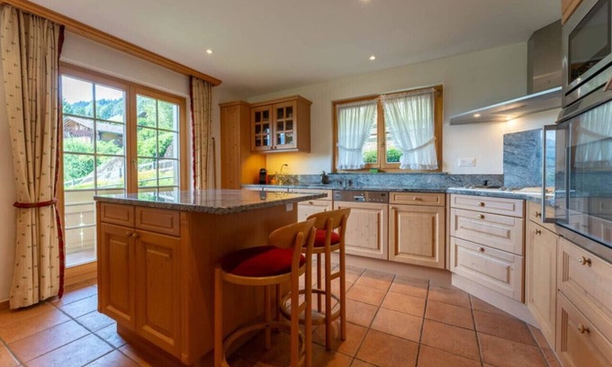 Rougemont Apartment | Stylish Alps apartment near Rougemont Village with mountain views.