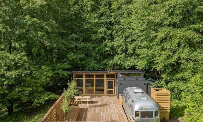 Delancey House | Sunlit Airstream in Trees with Expansive Deck + Nature Views