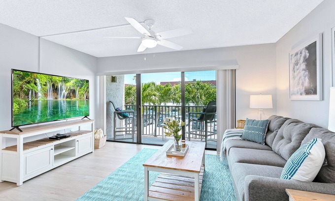 Port Canaveral Condo | Sunny Shores Retreat: Pool, Balcony & Steps to the Ocean!