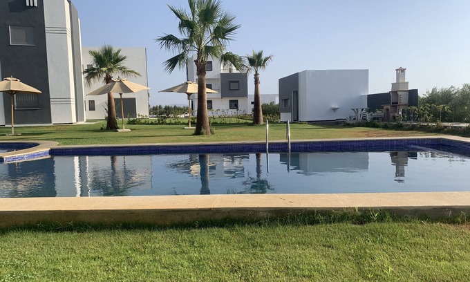 Bouficha Apartment | Superb modern app., richly furnished, pool view, lawned mountain garden