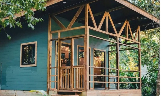 Bocas del Toro Cabin | Surfside tiny home with modern amenities like AC, modern design, bathtub,and TV.