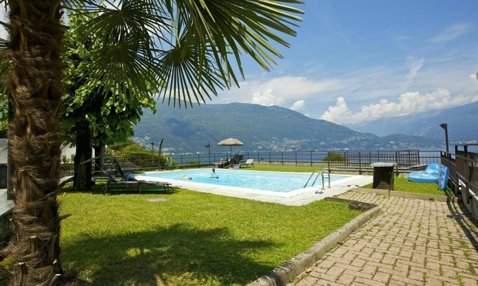 Pino Lago Maggiore Apartment | Tastefully furnished 2½-room apartment in a beautiful villa with pool