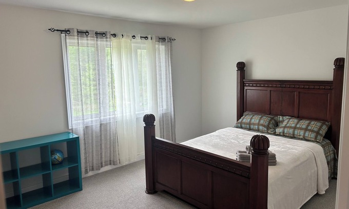 Angus House | The Angus Nest: Master Suite with Jacuzzi, fireplace —perfect for a retreat.