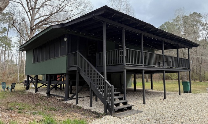 Fluker House | The Woods Camp w/fire pit, propane grill, and waterfront view on the River