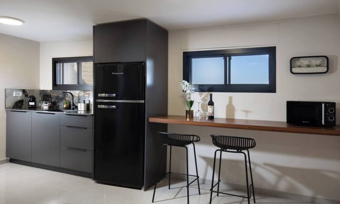 Tiberias Apartment | This cozy apartment offers ample space, featuring a comfortable living room perfect for relaxation