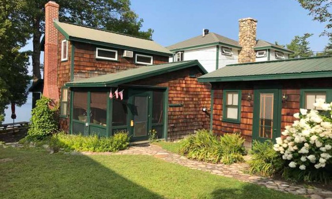 Raymond Cottage | Tranquil cottage near beach with private dock, spacious patio & modern comforts