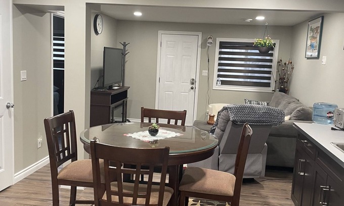 Stony Plain House | Tree facing back yard walkout unit at stony plain