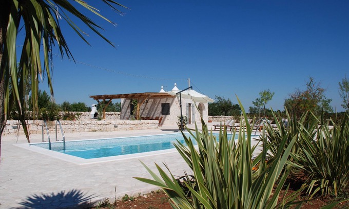 Alberobello Villa | Trulli Bianchi. Characteristic stone trullo with private pool and panoramic view