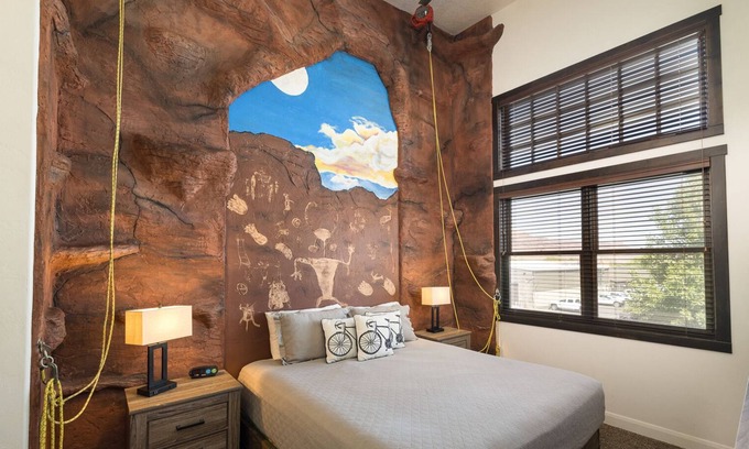 Moab Condo | Unique Stay in Downtown Moab! Master Bedroom Climbing Wall - Elevated Bunks