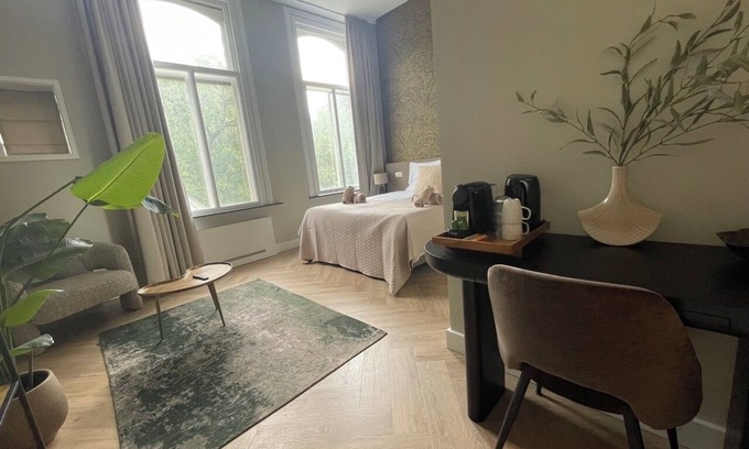 Centrum Apartment | Unwind in this refined suite, blending modern comfort with historic charm.