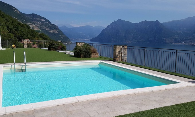 Tavernola Bergamasca Apartment | Vacation apartment with wonderful panoramic lake view, 2 terraces, pool, parking lot