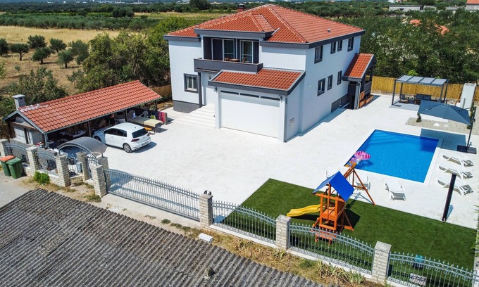 Zemunik Donji Villa | Villa Heaven, 12 PAX, private heated pool, pet friendly, children's playground