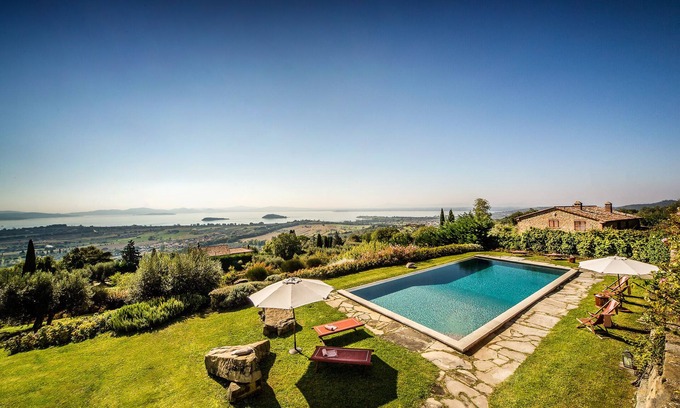 Passignano sul Trasimeno Villa | Villa with large pool that blends with the lines of the lake Trasimeno