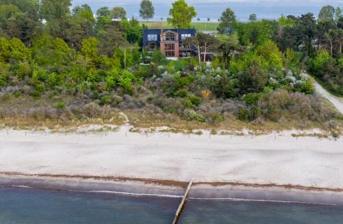 Hohe Dune Apartment | Villa Schmidt - Strandhaus direkt am Meer mit Sauna, Sport und Dünengarten I