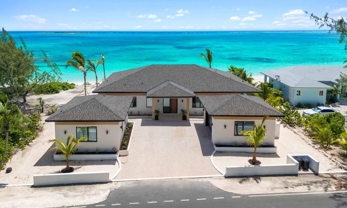 Tar Bay Villa | Villa Summerwinds, Beachfront on Flamingo Bay, Heated Pool + Carriage Home.
