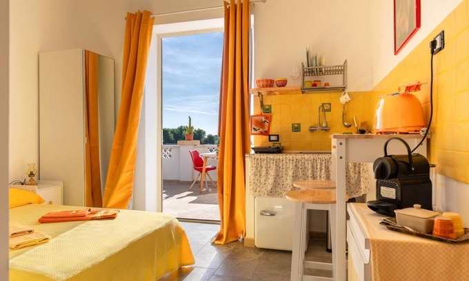 Monti D'arena-Bosco Caggione Apartment | VillaSalentu.it, Lu Sule with a huge terrace overlooking the sea, sky, land.