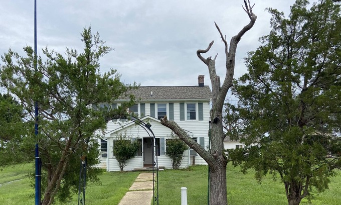 Piney Point House | Waterfront cottage with private pier, fireplace, and large yard.
