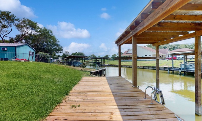 West Livingston House | Waterfront home with private deck, washer & dryer, and internet