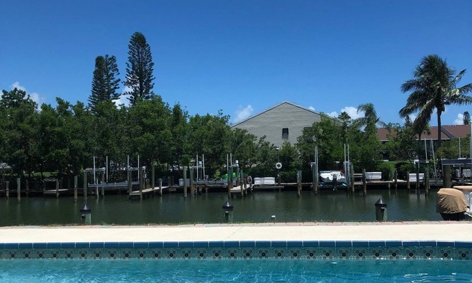 Fort Pierce Shores House | Waterfront Island Home with Dock, Pool and just steps to the Beach!