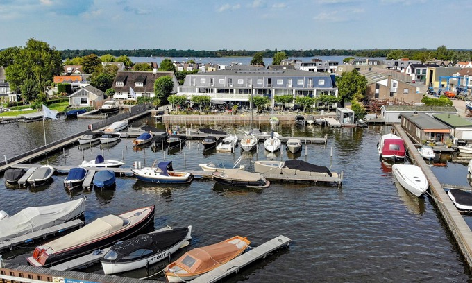 Oud-Loosdrecht Hotel | Waterfront Stay with Private Marina Access, Biking Trails and Lakeside Dining