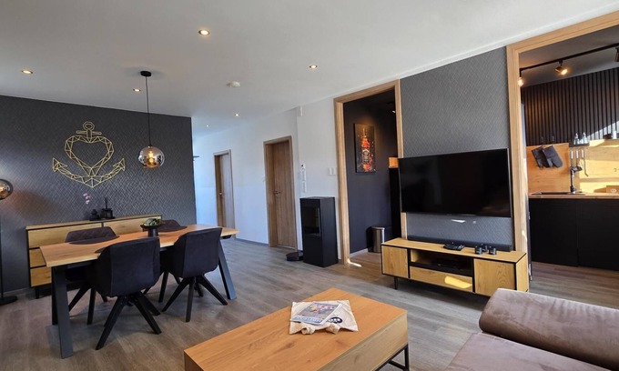 Dornumersiel House | Whirlpool + fireplace + dogs welcome + fully fenced garden + free WiFi + in quiet vacation settlement directly behind the dike/beach + fully equipped + own garden terrace covered + charging possibility e-car