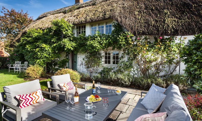 Urchfont Cottage | Wisteria Cottage is a late 18th century thatched cottage set in a small hamlet on the edge of a pict