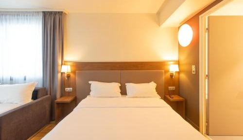 Quadruple Room with One Sofa Bed and One Double Bed
