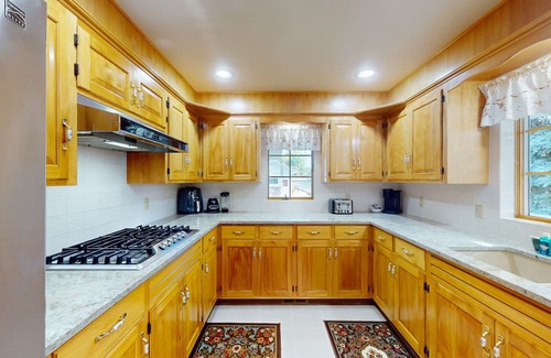 Post Falls House | Beautiful riverfront home with private dock, patio, pool table, WiFi, and W/D